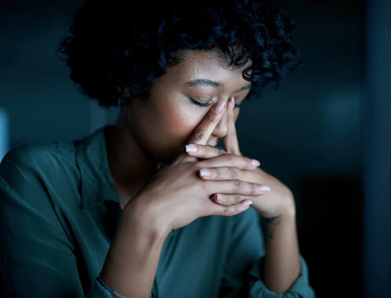 Woman experiencing sinus pressure and allergies.