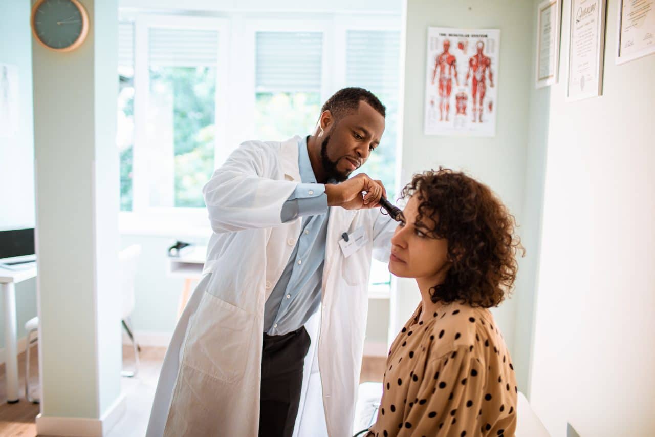 Close up of a doctor doing a medical exam on his patient