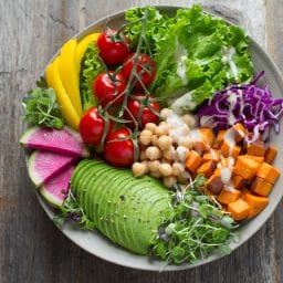 A colorful plate of healthy fruits and vegetables.
