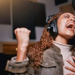 Young woman singing in a studio